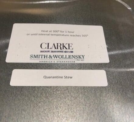 A metal food container labeled "Quarantine Stew" with heating instructions and the Smith & Wollensky logo on the lid, perfect for reheating in your luxury kitchen appliance or displaying in an upscale appliance showroom.