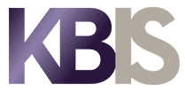 KBIS logo with bold, overlapping gradient letters in shades of purple and gray on a white background, reflecting the sophistication of luxury kitchen appliances like Wolf and Sub-Zero.
