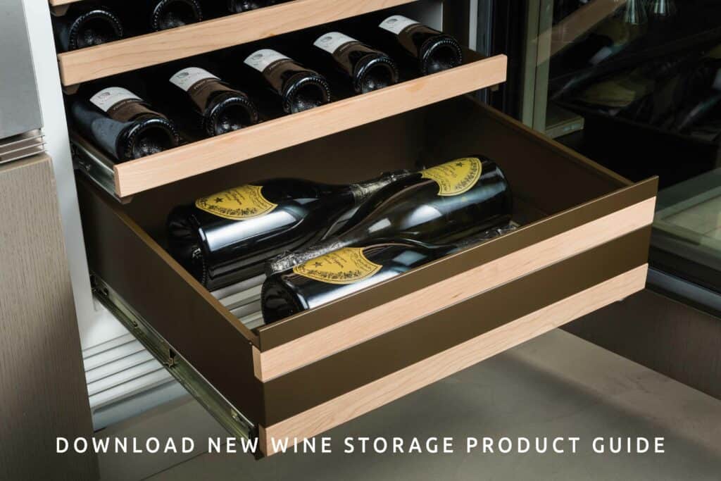 Open wine storage drawers filled with wine bottles, featuring wooden trim and metal slides in an appliance showroom, with a text overlay promoting a wine storage product guide download.