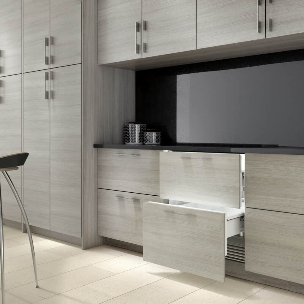 Panel-ready Sub-Zero refrigerator drawers allow the appliances to disappear into the cabinets.