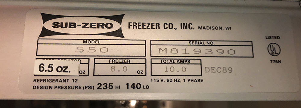Label for Sub-Zero Freezer Co. model 550, serial M819390—an iconic luxury kitchen appliance—8.0 oz freezer, 10.0 amps, 115V 60Hz, made Dec 1989 with refrigerant 12; ideal for any high-end kitchen showroom.