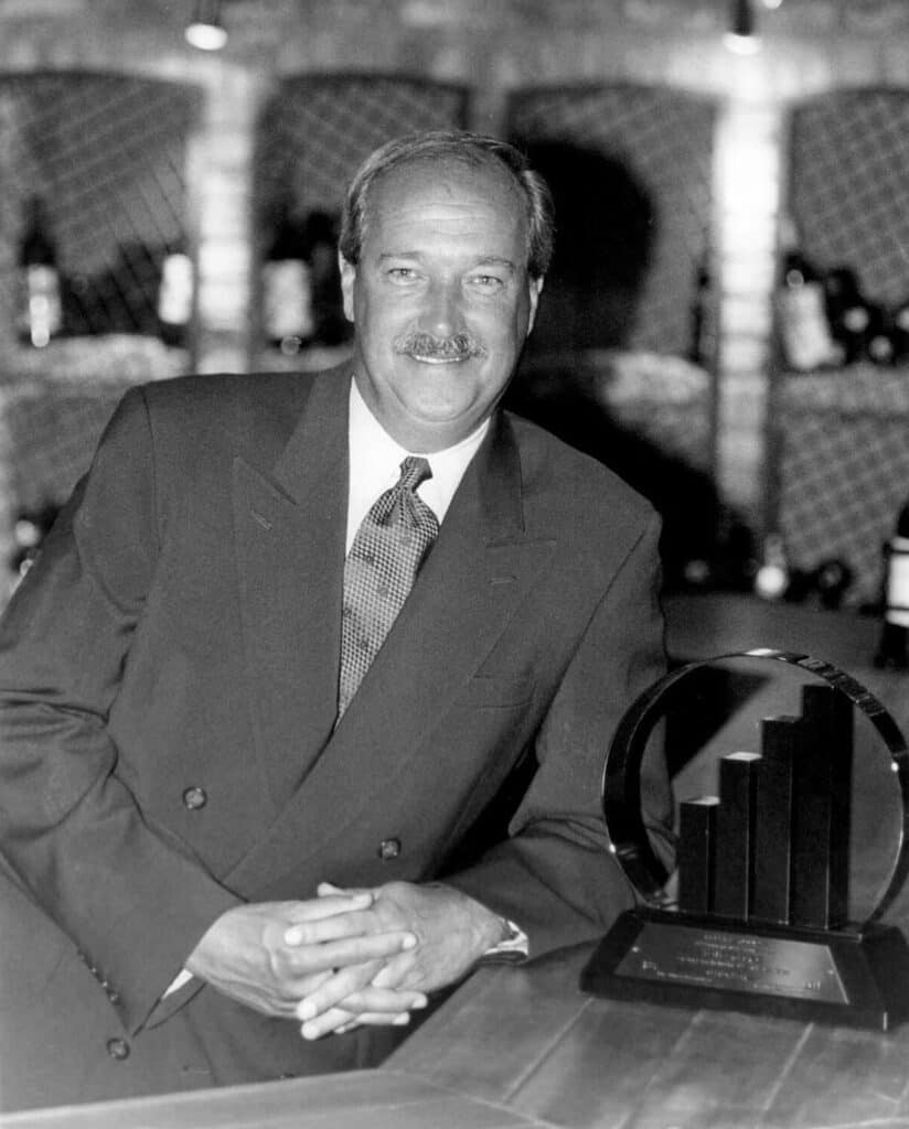 Tom Clarke wins Ernst & Young Entrepreneur of the Year in 1999.