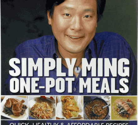 A man smiles on the cover of a cookbook titled "Simply Ming One-Pot Meals," with images of various dishes below the title—perfect inspiration for your kitchen showroom or next meal with Wolf and Sub-Zero appliances. Authors: Ming Tsai and Arthur Boehm.