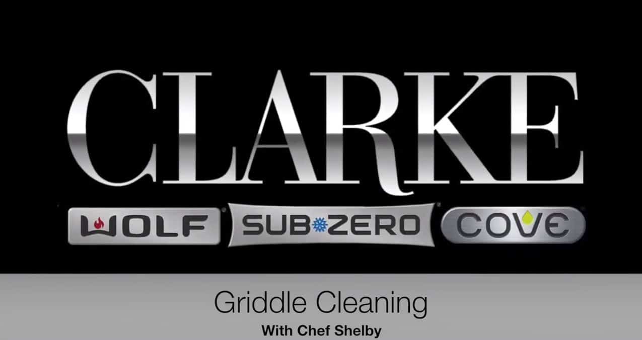 Logo image displaying "CLARKE" with "Wolf," "Sub-Zero," and "Cove" logos below; text reads "Griddle Cleaning With Chef Shelby" at the bottom, highlighting luxury kitchen appliance brands in a premium kitchen showroom setting.