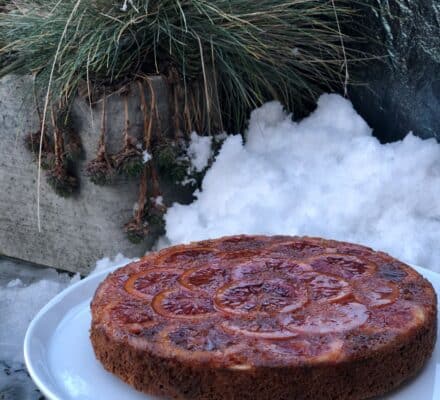 Moist and fragrant orange olive oil cake topped with a light glaze and garnished with fresh orange slices