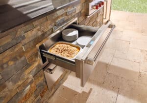 Wolf Outdoor Warming Drawers keep plates and side dishes warm until the meal is totally ready.
