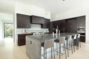 This sleek contemporary space designed by Scandia Kitchens offers secrets in every corner.