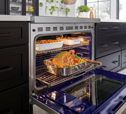 A food in an oven, expertly prepared with a Wolf appliance, showcases the innovation you’ll find in any modern kitchen showroom.
