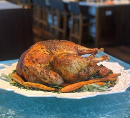 Juicy and perfectly cooked turkey in a steam oven, with golden-brown skin and aromatic herbs