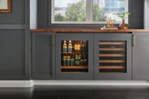 Sub-Zero Undercounter Refrigeration including ADA-compliant wine storage and beverage center in a study.