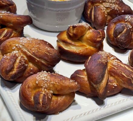 Warm Soft Pretzels served with a creamy Beer Cheese Sauce, perfect for a savory snack or appetizer at any gathering