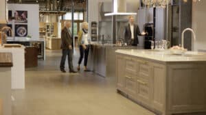 Clarke Showroom Manager Jeremy McCulla leads a Boston couple on a tour of the Clarke Showroom to exemplify the features of the best luxury kitchen brands.