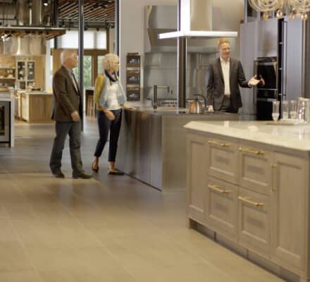 Clarke Showroom Manager Jeremy McCulla leads a Boston couple on a tour of the Clarke Showroom to exemplify the features of the best luxury kitchen brands.