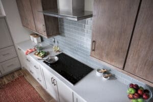 A Wolf Electric 36” Cooktop offers a sleek look with seamless temperature adjustments.