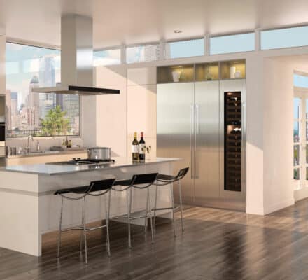 Sub-Zero Freezer between a Sub-Zero Refrigerator and Wine Storage present a sleek, clean food and drink preservation trio in this city condo.