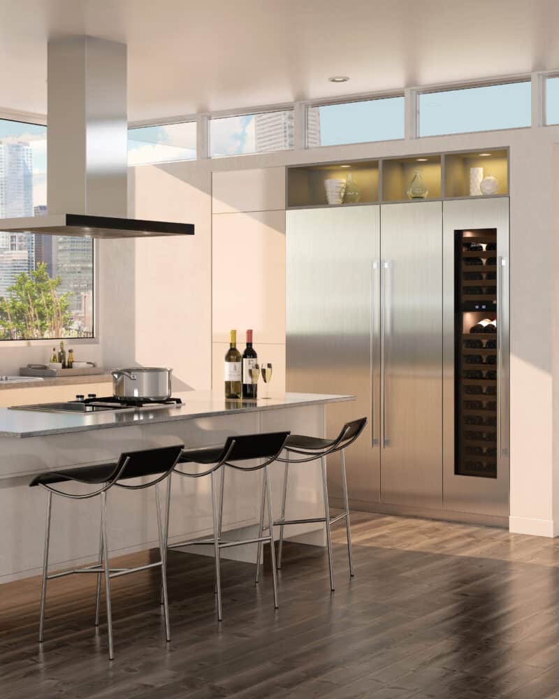 Sub-Zero Freezer between a Sub-Zero Refrigerator and Wine Storage present a sleek, clean food and drink preservation trio in this city condo.
