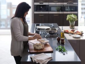 Many Wolf kitchens combine a cooktop with wall ovens.