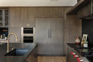 When considering whether luxury appliances are worth it, consider how this Wolf Wall Oven and Convection Steam Oven make the perfect pair in this designer kitchen.
