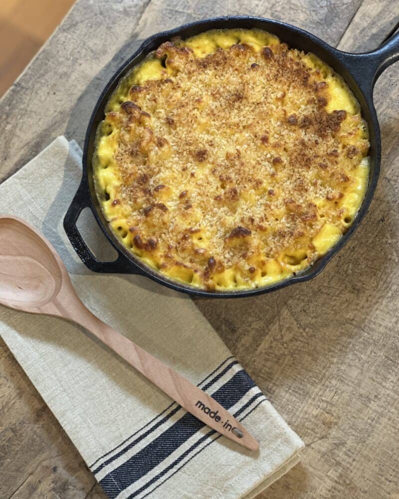 Rich and creamy Mac & Cheese in a baking dish, topped with a golden breadcrumb crust, perfect for a comforting and indulgent meal