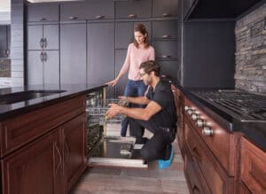 A Factory Certified Installer showing a customer a newly installed Cove dishwasher